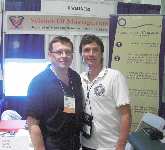 O. Buoimer (right) and Dr. Ross Turchaninov (left) in front of the Science of Massage booth